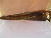 Country landscape painted on hand saw