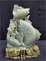 Asian glass fish on stone base,