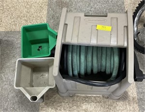 Garden hose and reel with seed spreaders