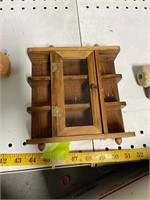 Small wooden trinket shelf