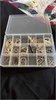 Jewelry in plastic bin