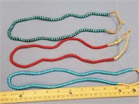 3 Strands of trade beads, 2 blue, 1 red        (f