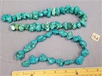 2 Strands of turquoise colored stones        (f 16