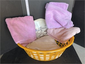 Yellow laundry hamper w/ towels