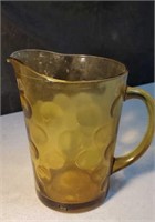 Amber colored pitcher approx 8 inches