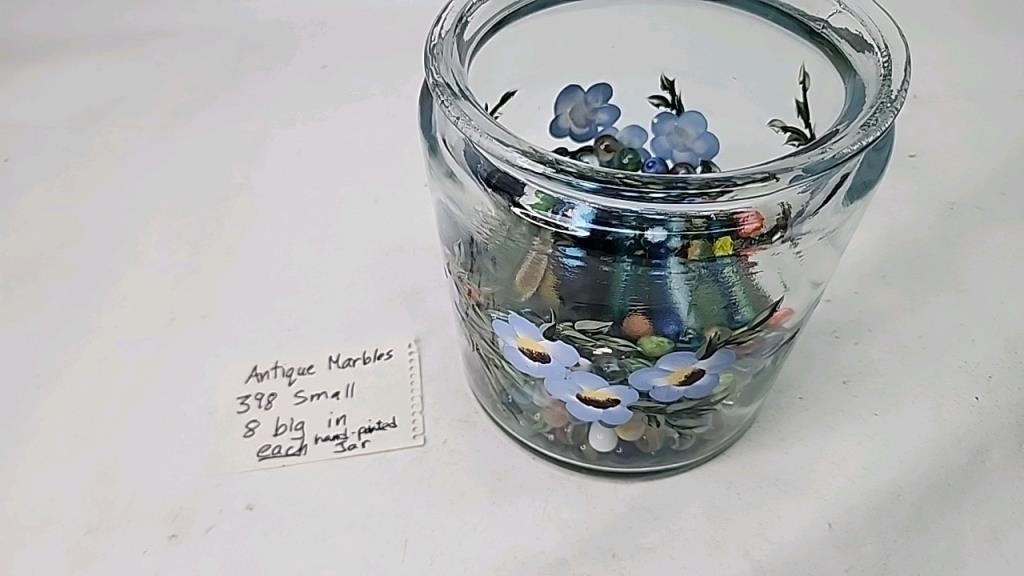 Antique marbles in hand painted jar