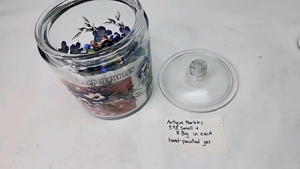 Antique marbles in hand paint jar