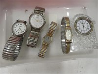 4 watches and a clock