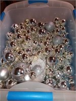 Silver and white ornament balls with snow