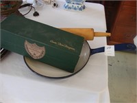 Enameled blue cast iron skillet, rolling pin, and