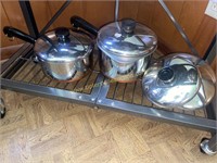 2 revere ware sauce pans with 4 extra lids