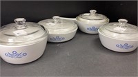 Set of 4 Corning Ware baking pots with lids.