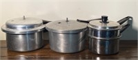 2 pressure cookers and a double boiler