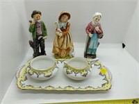 Figurines and cream/sugar and tray