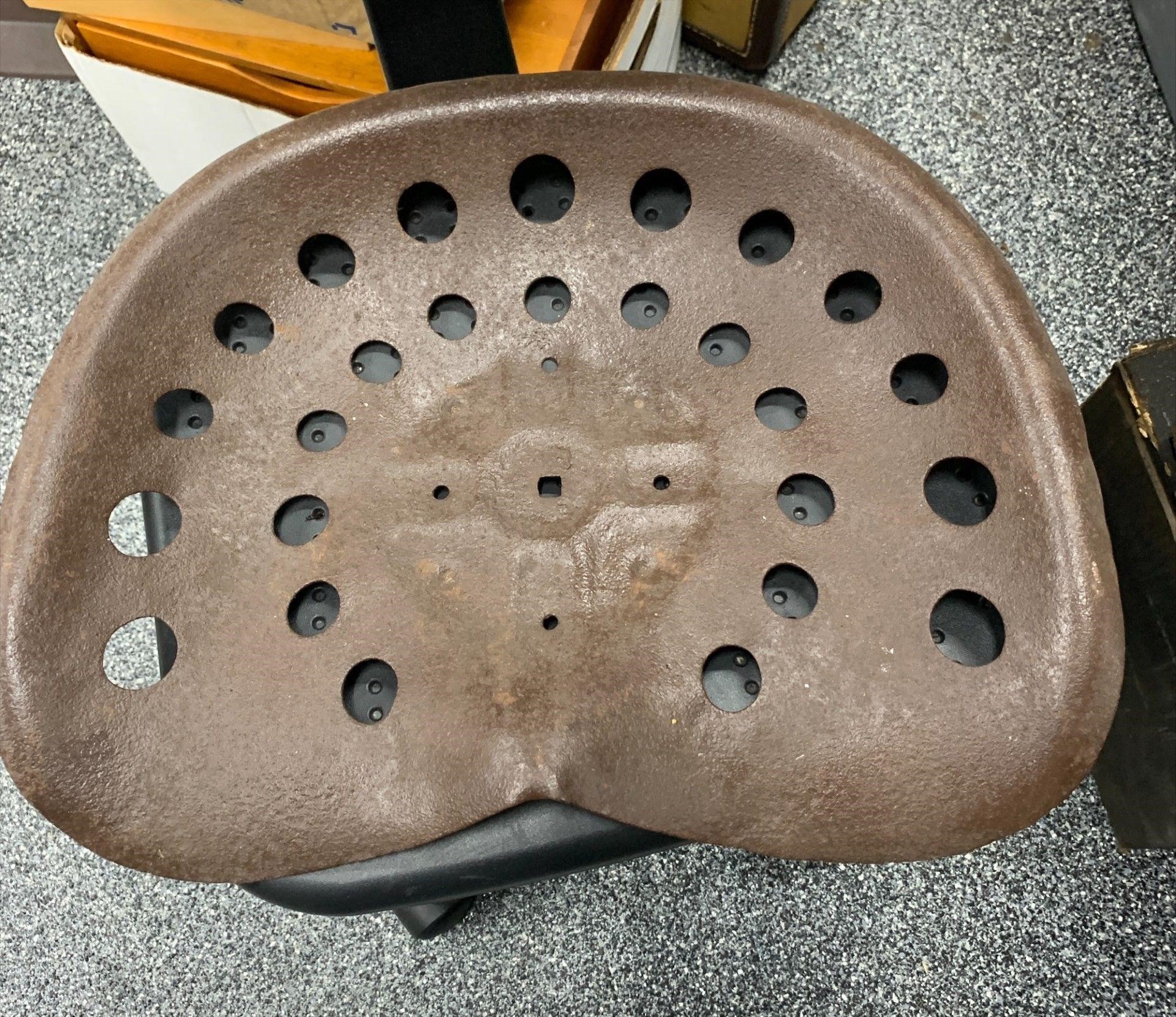 Metal tractor seat