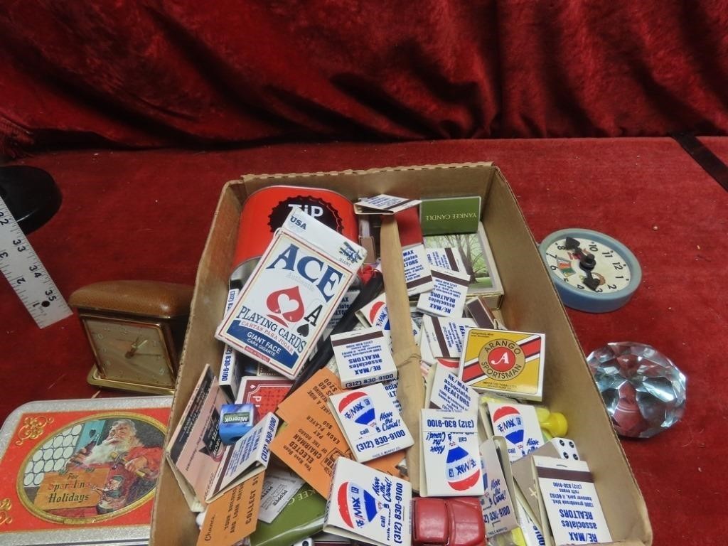 Playing cards, travel clock, bank, toys, matchbook