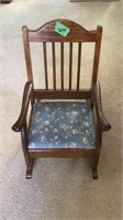Child’s wood rocking chair. 22” tall.