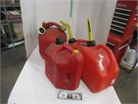 Four plastic gas cans