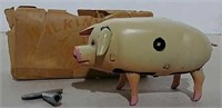 Tin wind up walking pig