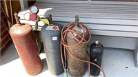 4 Acetylene tanks, 3 larger, 1 smaller, unknown