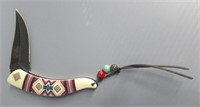 Folding knife with Native American design by MC