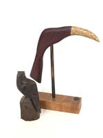 Wooden bird statue and bird display