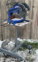 Benchtop chop saw on rolling stand
