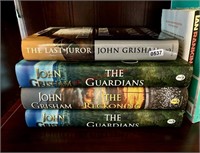 4 Hardcover Books by John Grisham (back room)