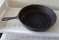 Lodge cast iron skillet with raised ribs in bottom