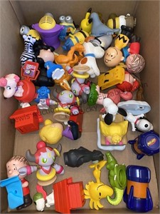 Box of toy figurines including peanuts, minions
