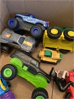 Box of toy cars monster trucks, ambulance, hot