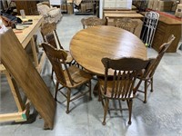 Table with leaf and 6 chairs 48in diameter 32in