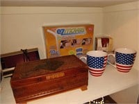 Shelf contents: coffee mugs, wooden box,