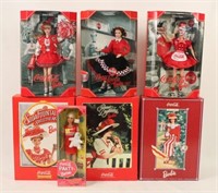 Seven Coca Cola Barbie Dolls