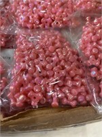 Two boxes plastic 10 mm propeller beads pink