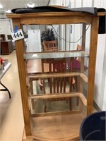 Lighted curio cabinet with missing glass shelves