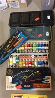 2 tins of water color, 2 boxes, guitar water