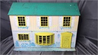 Vintage metal dollhouse with yellow trim