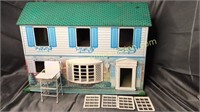 Vintage tin dollhouse with windows and doll high