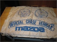 38" x 27" 1987 AIBF Mazda Chase Vehicle Banner