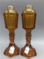 Pair early Amber glass oil lamps