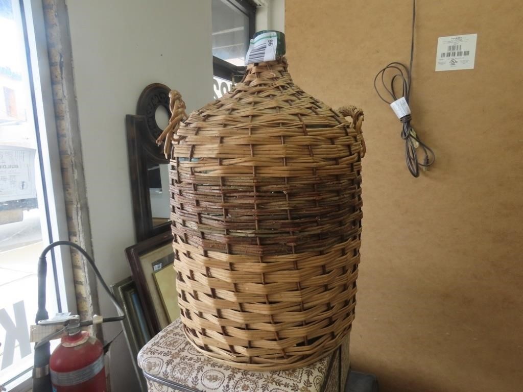 Large glass bottle w/woven cover.