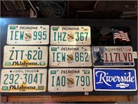 Set of 9 license plates.