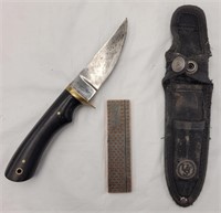 Fixed blade knife with sheath and sharpening stone