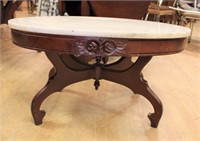 Oval marble top coffee table