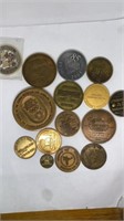 Collection of different sizes medallion coins,