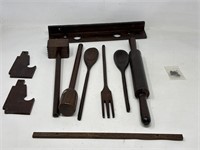 Wooden spoons and rolling pin with wall hanging