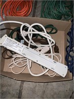 box lot of cords and surge protectors