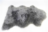 TWO SHEEP SKIN FURS