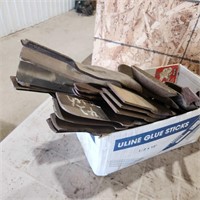 Various sized used lawnmower blades